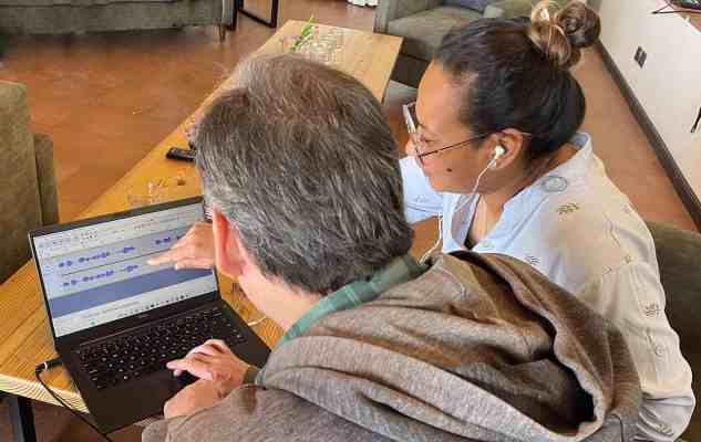 man and woman looking at laptop